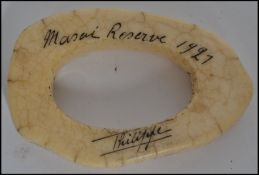 A Masai reserve ivory napkin ring with notation dating to 1921 made from an elephant that died on