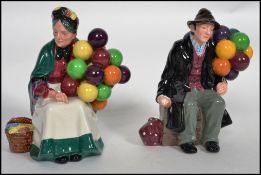 A pair of Royal Doulton ceramic figurines Old Balloon Seller HN1315 (HN 1315) and Old Balloon Man