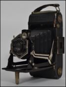 A vintage mid 20th century Zeiss Ikon bellows camera complete in it's original leather case.