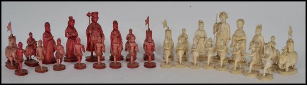 A fantastic early 19th Century Canton period ivory chess set the red stained side king and queen