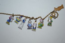 A stunning vintage charm bracelet featuring eight enamel charms modelled on Walt Disney's Snow White