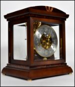 A Kieninger model RWU04 bracket mantle clock, brass dial with silvered chapter ring, subsidiary