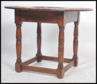 An unusual carved oak Victorian centre table being raised on block and turned legs with peripheral