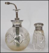 A hallmarked silver and cut glass perfumer bottle atomiser of spherical form along with a silver