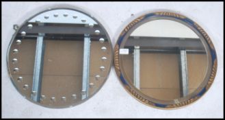 Two vintage bevelled glass circular mirrors one with lacquer the other with gilt decoration.