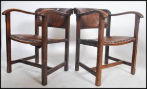 A pair of  bentwood oak art deco dining chairs having full grain brown  leather upholstered seats