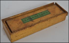 A boxed antique Spellicans ivory game in original slide out box with applied green plaque reading