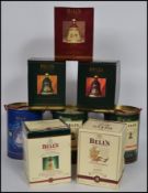 A good group of 8 boxed Bells whisky Wade bell shaped decanters in original boxes.