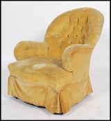 A Victorian Howard style mahogany armchair being b