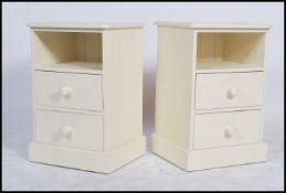A pair of contemporary painted country pine bedsid