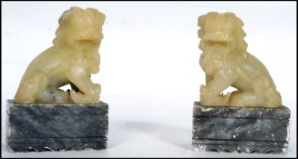 A pair of Chinese Jade temple dogs being mounted o