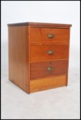 A vintage industrial mid century golden oak pedestal chest / bank of drawers with metal 'D cup'