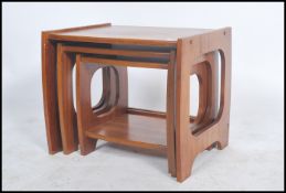 A retro teak wood 1970's graduating nest of tables in the the manner of G Plan. The tables having