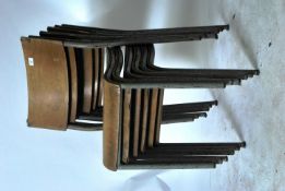 A set of six 1950 / 60's steel tubular stacking chairs with panel seats and backs