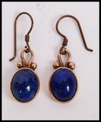 A pair of  9ct gold / 375 Lapis Lazuli ladies earrings having Lapis Lazuli insetdrops  with gold