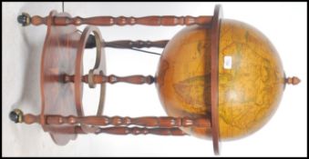 An antique style Cocktail drinks cabinet in the Form of a Globe with Hinged Top Section to Fitted