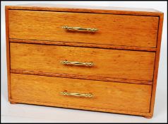 A mid 20th century scratch built three drawer cutlery canteen having an appointed baize lined