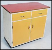 A 1950's mid century Formica kitchen cabinet with short drawers and cupboards together with 2