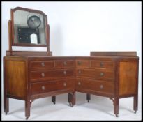 An Edwardian mahogany dressing table chest of drawers together with a matching chest of drawers.