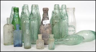 A collection of vintage advertising bottles dating from the 19th and 20th century, many local
