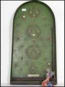 A vintage Corinthian 21S Bagatelle game of wooden form in original green paint complete with balls
