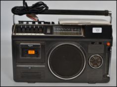 A vintage retro 1970s/80s JVC radio/cassette/TV entertainment system in black with dials to front.
