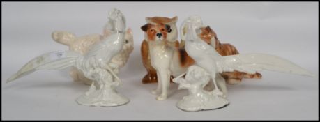 A collection of vintage ceramic animals to include a pair of Italian white ceramic bird figurines,