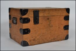 A vintage plywood and ebonized metal bound work/tool box having a hinged lid.
