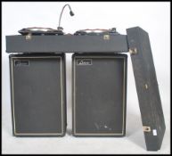 A vintage DJ record deck system and speakers consi