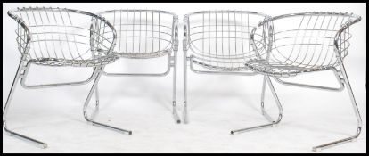 A set of four retro / vintage 20th century steel wire frame cantilever chairs in the manner of Harry
