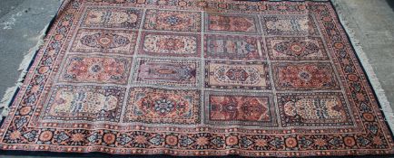 A large 20th century Persian / Islamic floor carpet rug having geometric medallions and spandrels.