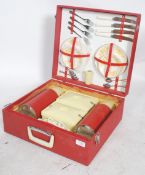 A vintage 1960's / 1970's retro picnic hamper by Revelation. The case with red vinyl outer being