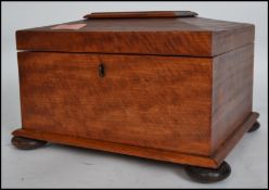 A 19th century Regency satinwood ladies workbox of