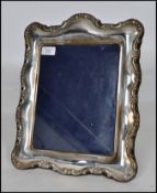 A large silver hallmarked easel back picture frame