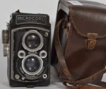 A  vintage MPP Micro Precision Products Microcord twin lens reflex camera in a brown leather case,