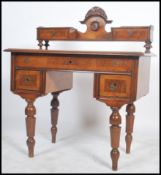 A 19th century Italian walnut biedermeier writing table desk being raised on inset turned legs