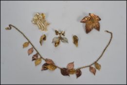 A group of Danish silver and other jewellery to include a Flora Danica gilt silver leaf brooch in