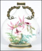 A 19th century Minton moon flask vase hand painted with flora on a white ground with naturalistic