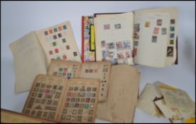 A collection of vintage philatelic stamps mostly held within albums to include GB and rest of