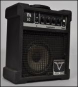A vintage Va10 V guitar amp in black with dials to