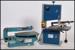 A hobbyist Seally Professional Bandsaw together with a Clarke Woodworker 16