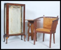 A small china display cabinet raised on cabriole legs together with a Windsor style chair and an