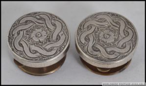 A pair of 19th / 20th century Bachelors silver buttons / cuff links, each being chase decorated.