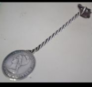 Spoon set with Brazilian coin marked  ' orderprogresso 500 reis '  to front and ' Republica Dos