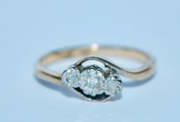 A hallmarked 9ct gold and platinum diamond three stone ring. Marked 9ct & Plat. Size N. Weight 2.2g.