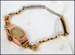 A 20th century hallmarked 9ct gold ladies cocktail watch having a Swiss made movement. Weighs