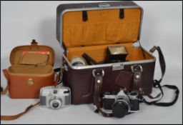 A  vintage Nikon FM2 camera and accessories to include camera bag, 50mm f1.8 lens, 24mm f2.5mm lens,