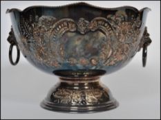 A stunning late 19th century silver plated fruit / punch bowl raised on a pedestal, having twin lion