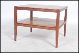 A stunning retro 20th century Danish square teak wood coffee table raised on square tapering legs