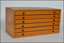 A vintage 20th century pine specimen / tools cabinet having multiple pull out drawers with handles.